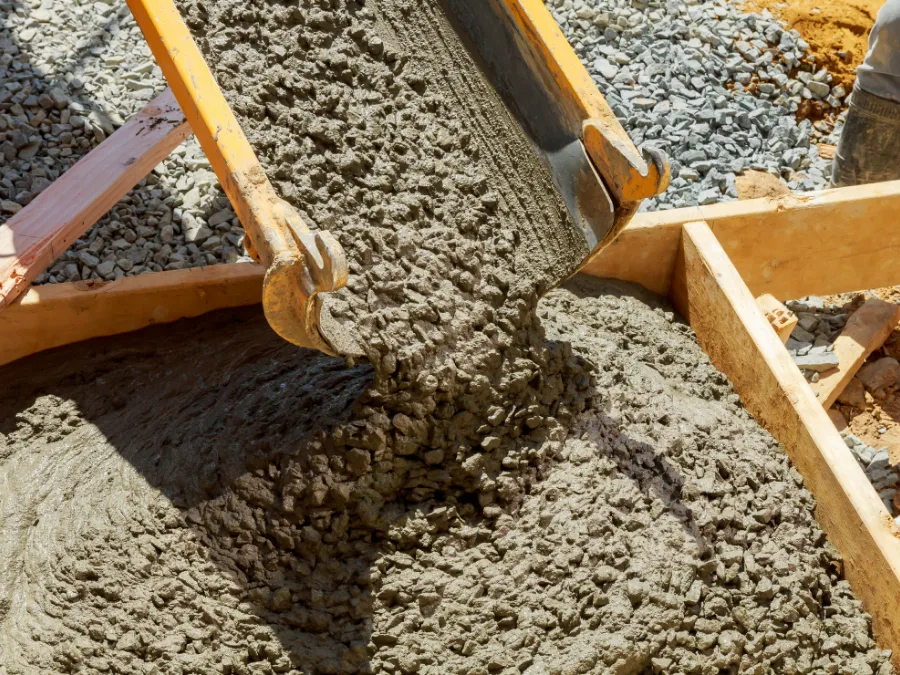 Concrete being placed into timber forms on a residential job